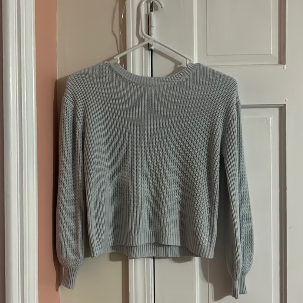 I am selling a baby blue knitted sweater from the brand copper key!